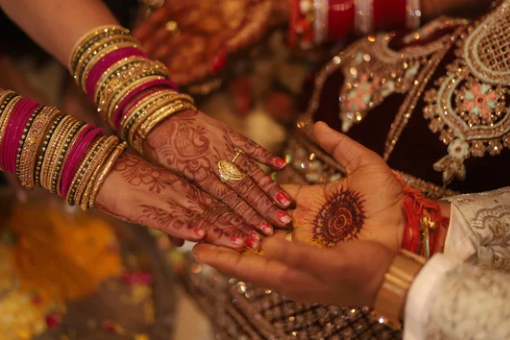 Bride and groom's hands during the ring ceremony